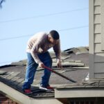 Men repair the roof