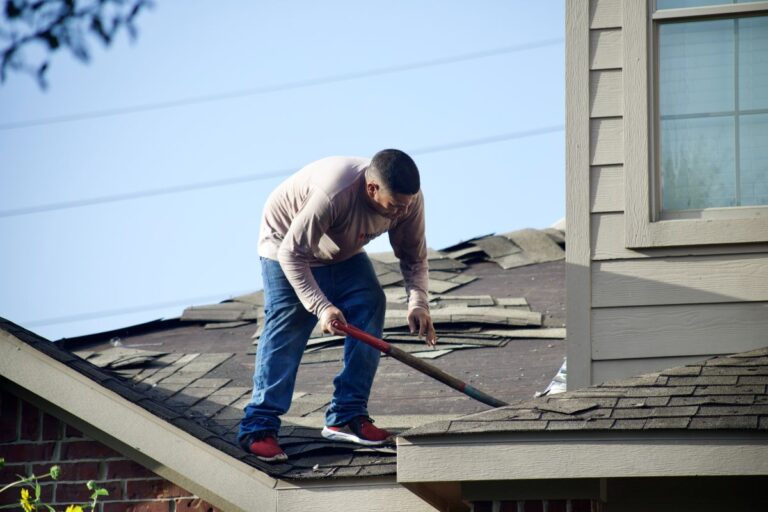 Men repair the roof